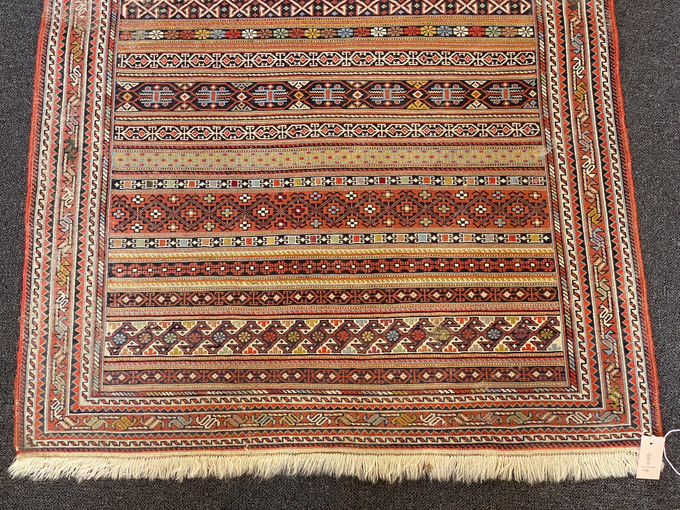 A fine Sumac flatweave polychrome rug 160 x 100 cms